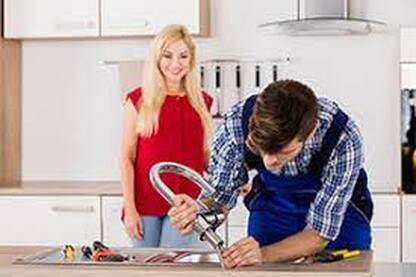Plumber with customer